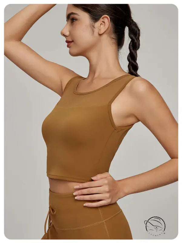 Woman in Langry Beauty Back mesh workout top and high-waisted bottoms