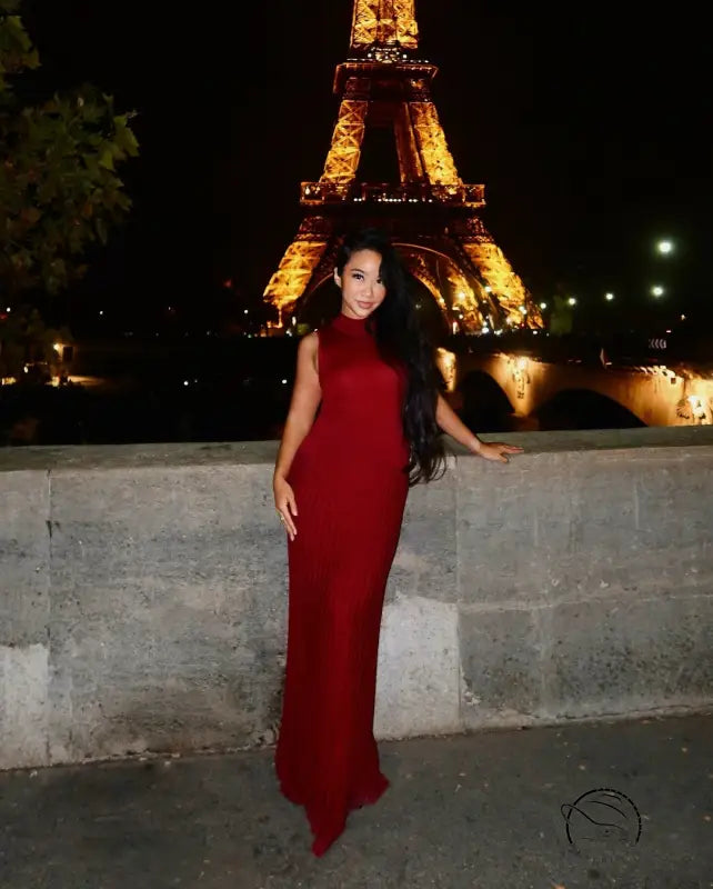 Elegant woman in long red knitted maxi dress for enchanting fashion