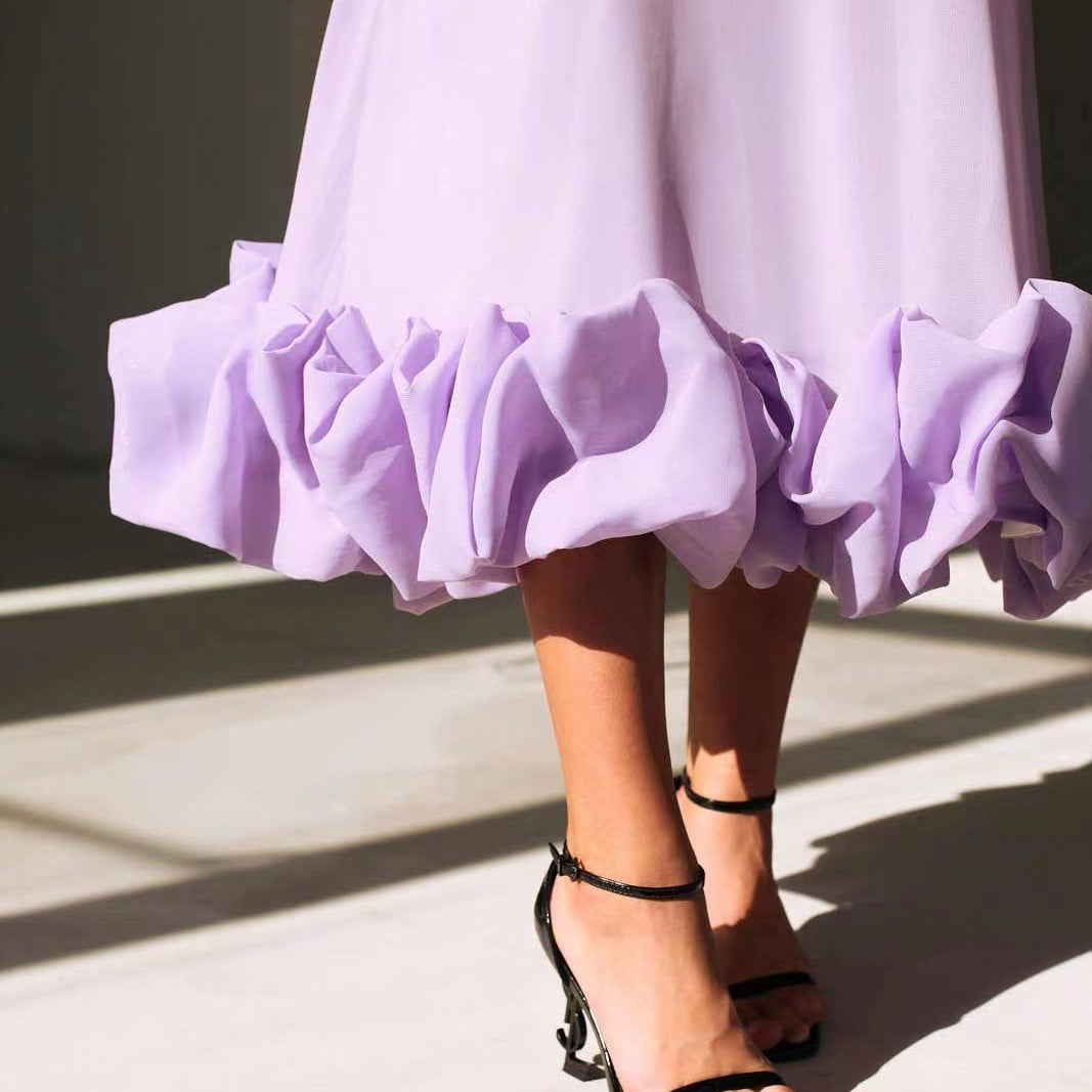 Lavender three dimensional floral A-line dress with ruffled hem and black strappy heels
