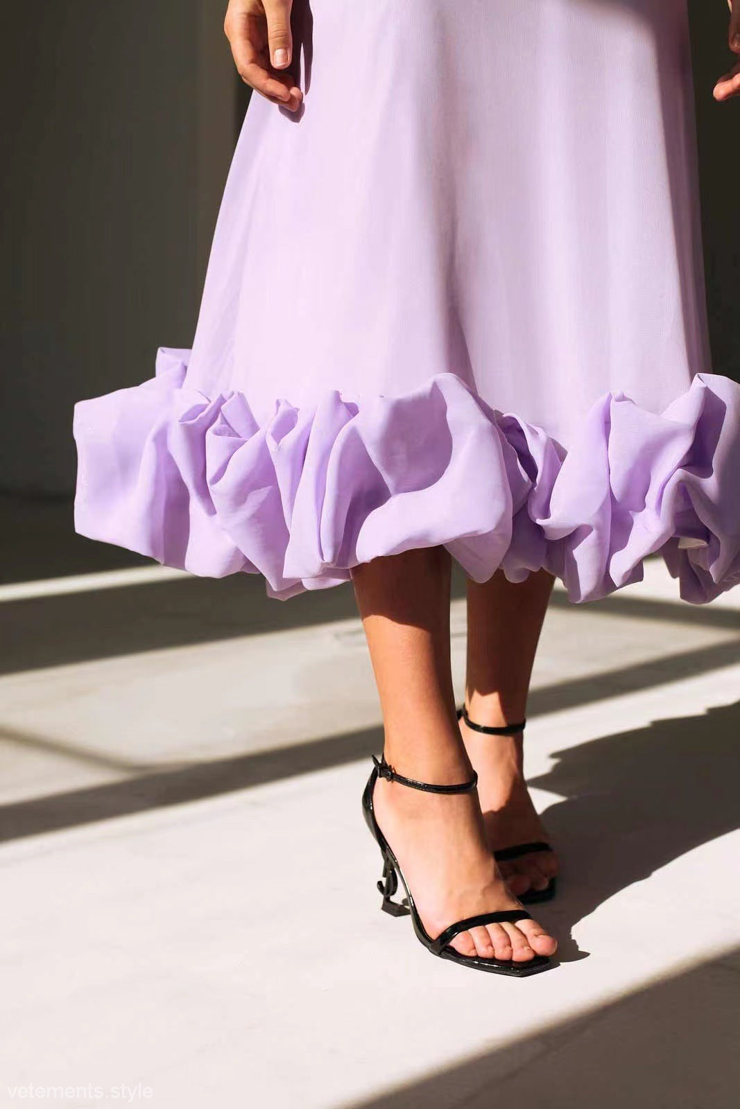 Lavender three dimensional floral A-line dress with ruffled hem and black strappy heels