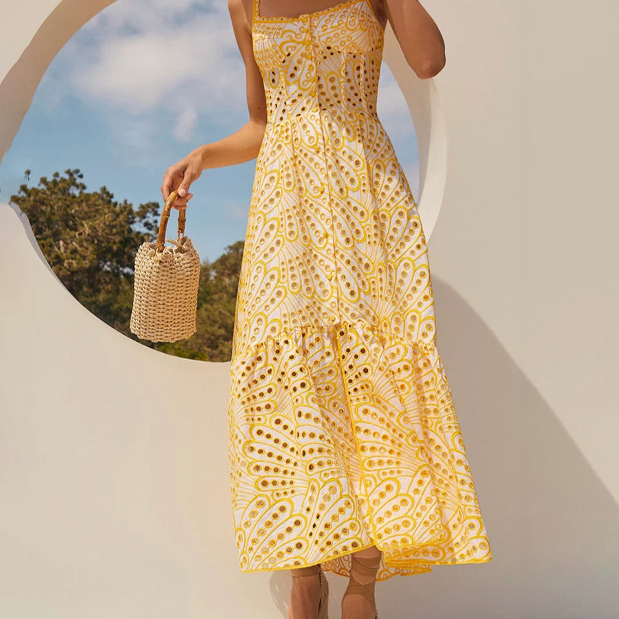 Yellow eyelet midi dress showcasing langry fashion with a slimming waist and elegant design