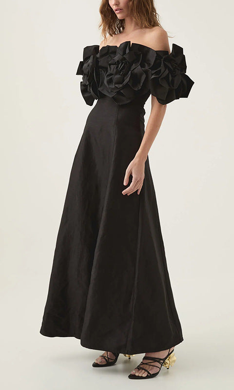 Elegant black off-the-shoulder maxi dress, perfect for fashion-forward occasions
