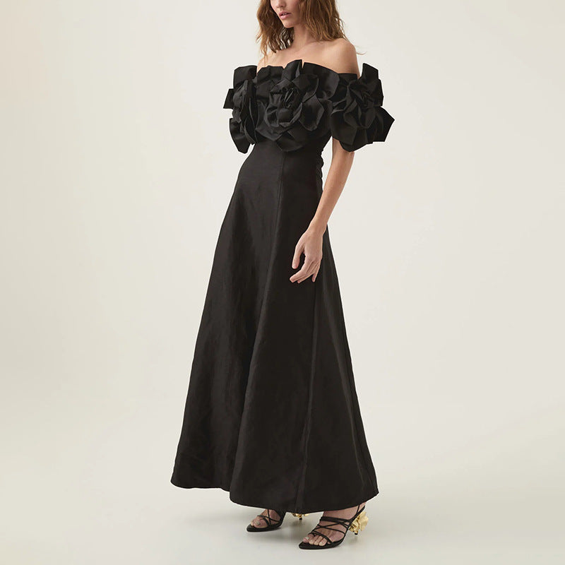 Elegant black off-the-shoulder maxi dress, perfect for fashion-forward occasions
