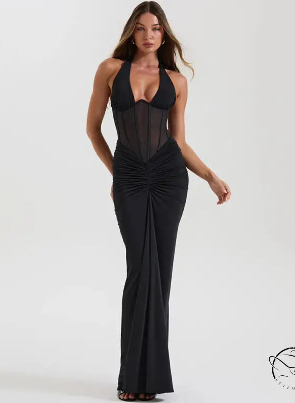 Elegant black halter neck maxi dress with ruched detailing and sheer chest panel in langry fashion