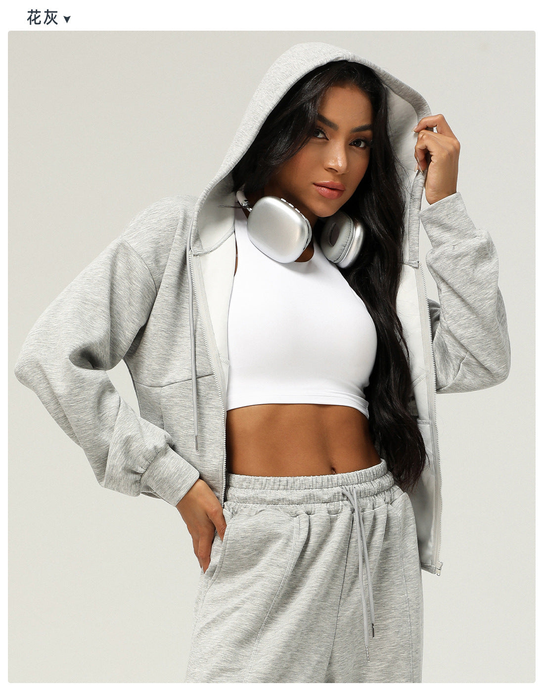 Woman in gray hooded tracksuit with headphones showcasing trendy Langry fashion ملابس