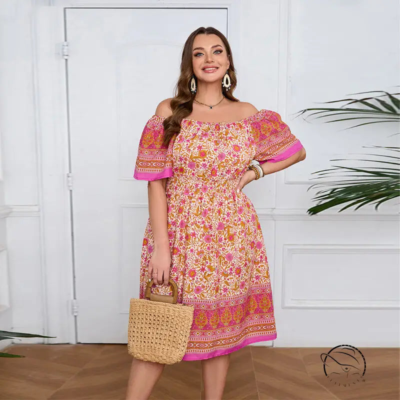 Smiling woman in elegant bohemian dress with floral print and straw bag