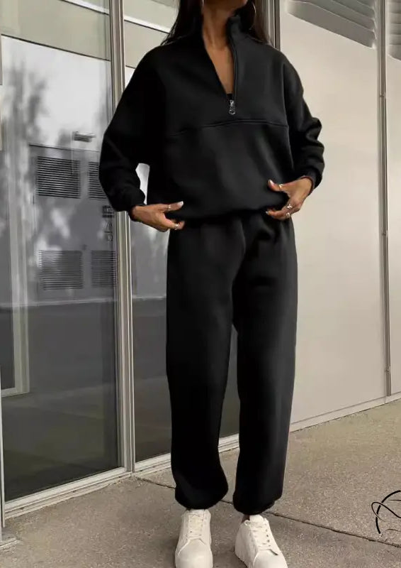 Langry black zip-up tracksuit with white sneakers, minimalist fashion ملابس