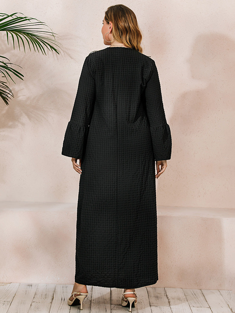 Black textured winter robe dress with flared sleeves and elegant embroidery