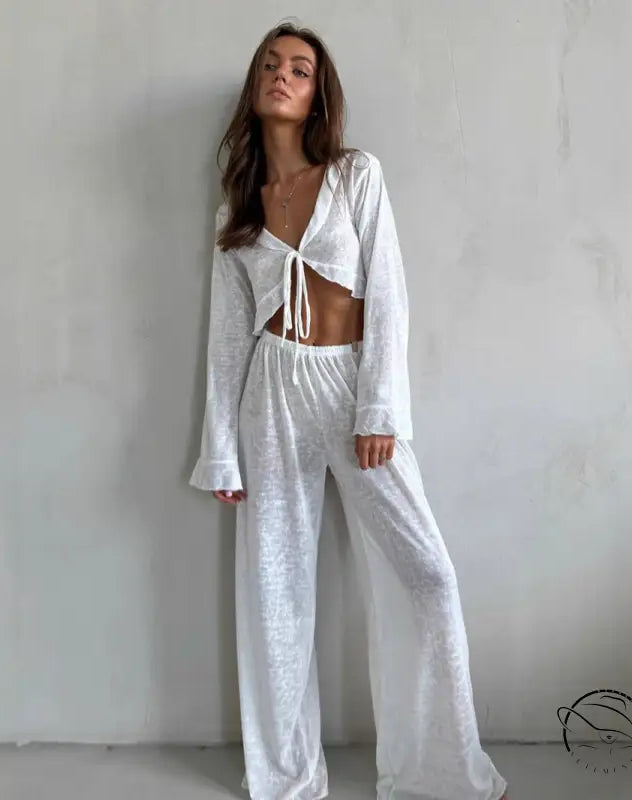 Woman modeling casual loose pajamas in white two-piece set