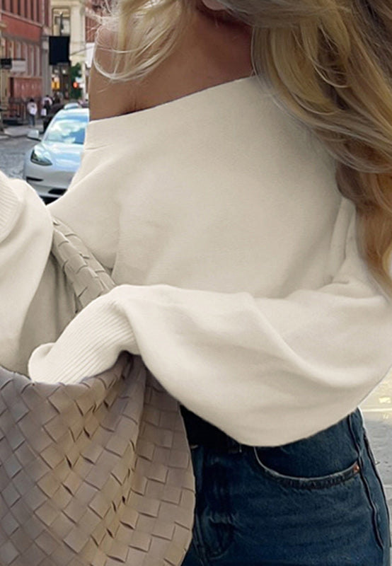 Cream off-shoulder langry fashion top with Bottega Veneta tote