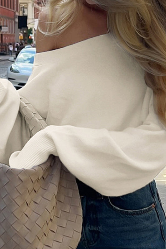 Cream off-shoulder langry fashion top with Bottega Veneta tote