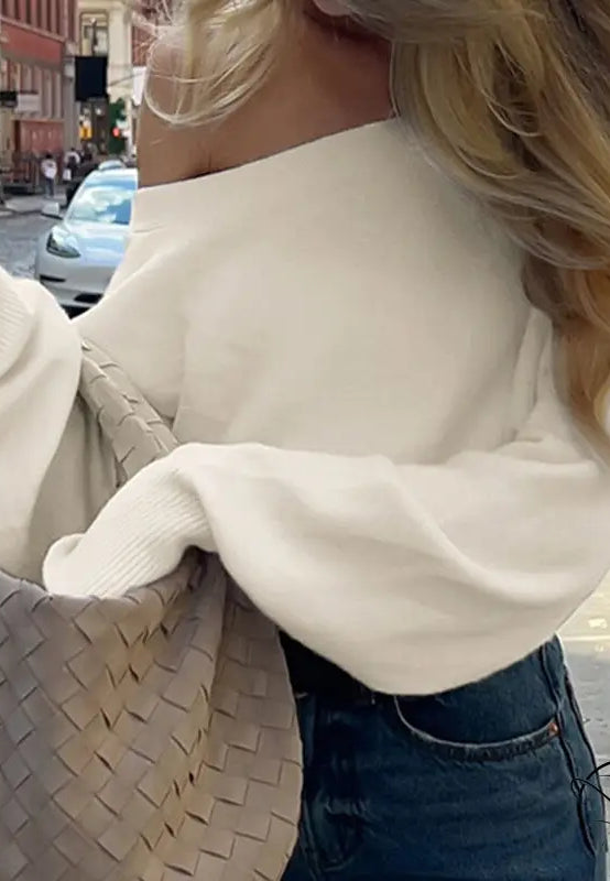 Cream off-shoulder langry fashion top with Bottega Veneta tote
