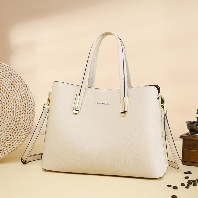 Elegant Soft Leather Bag in white with gold hardware, perfect for fashion enthusiasts