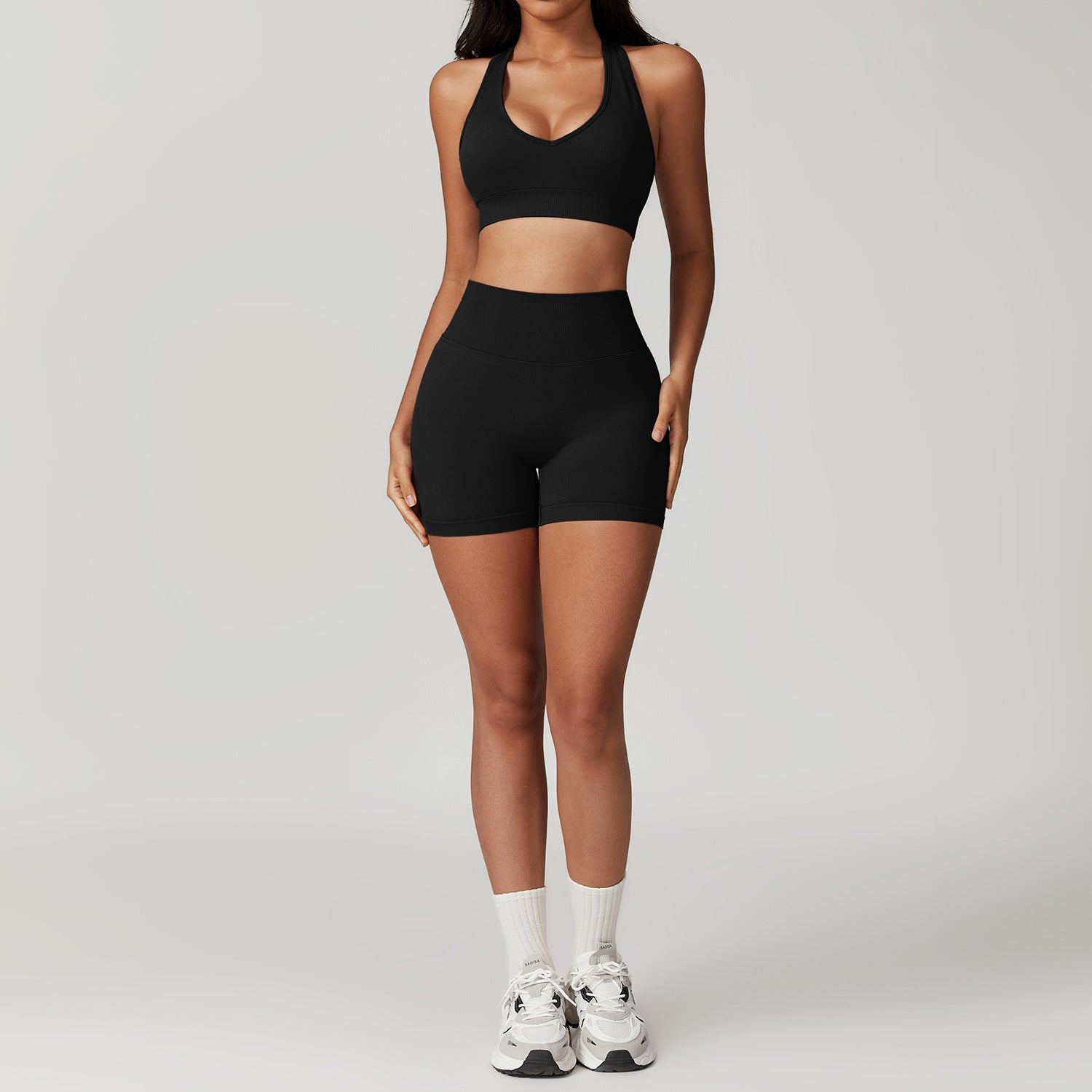 Black Halter-Neck Sports Bra and Shorts Set from SEAMLESS YOGA SUIT, ideal for workouts