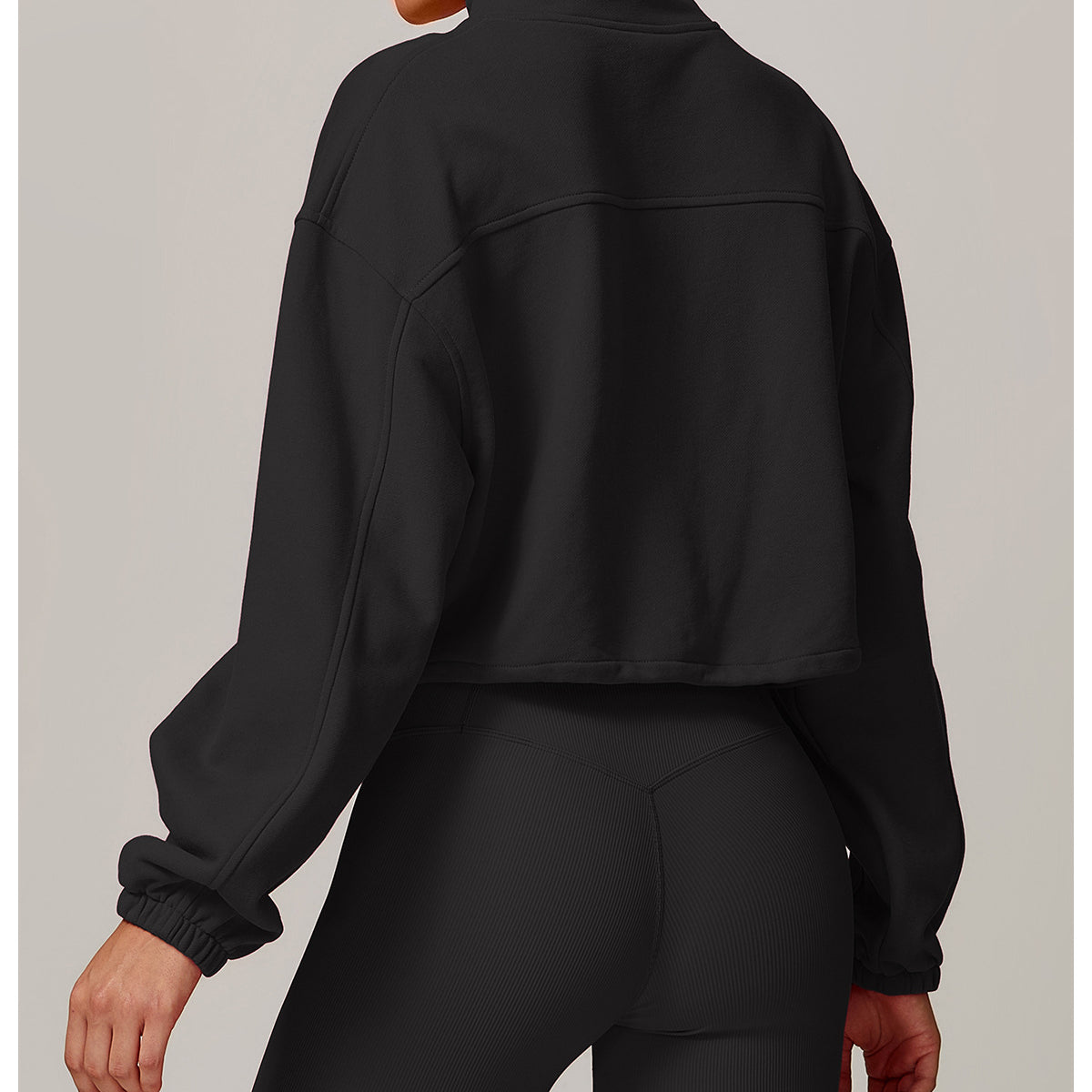 Black cropped athletic jacket back view, ideal for casual and fitness fashion by Langry