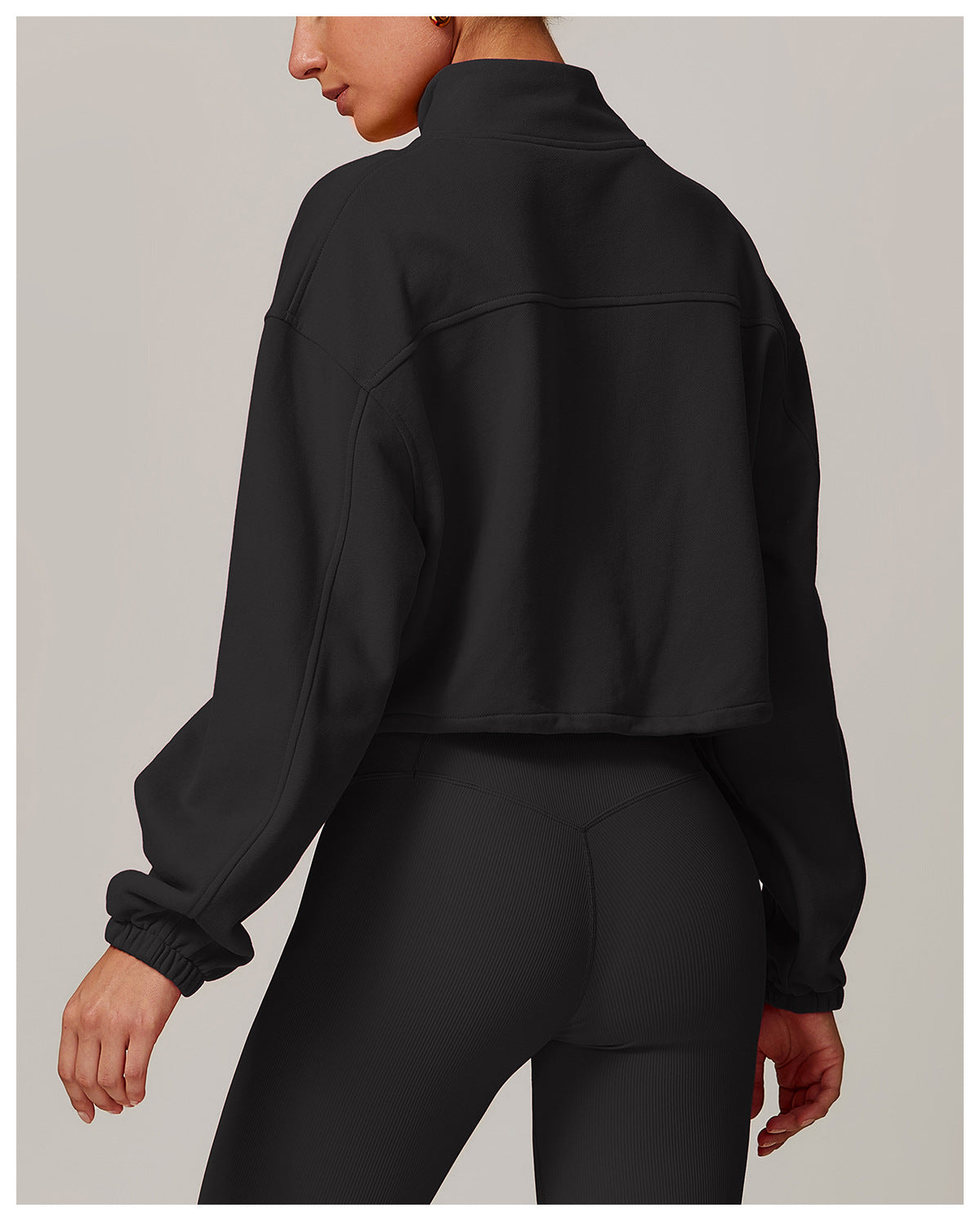 Black cropped athletic jacket back view, ideal for casual and fitness fashion by Langry