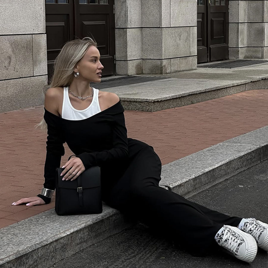 Person in black off-shoulder outfit and white sneakers showcasing Attractive Two Piece Vest Dress