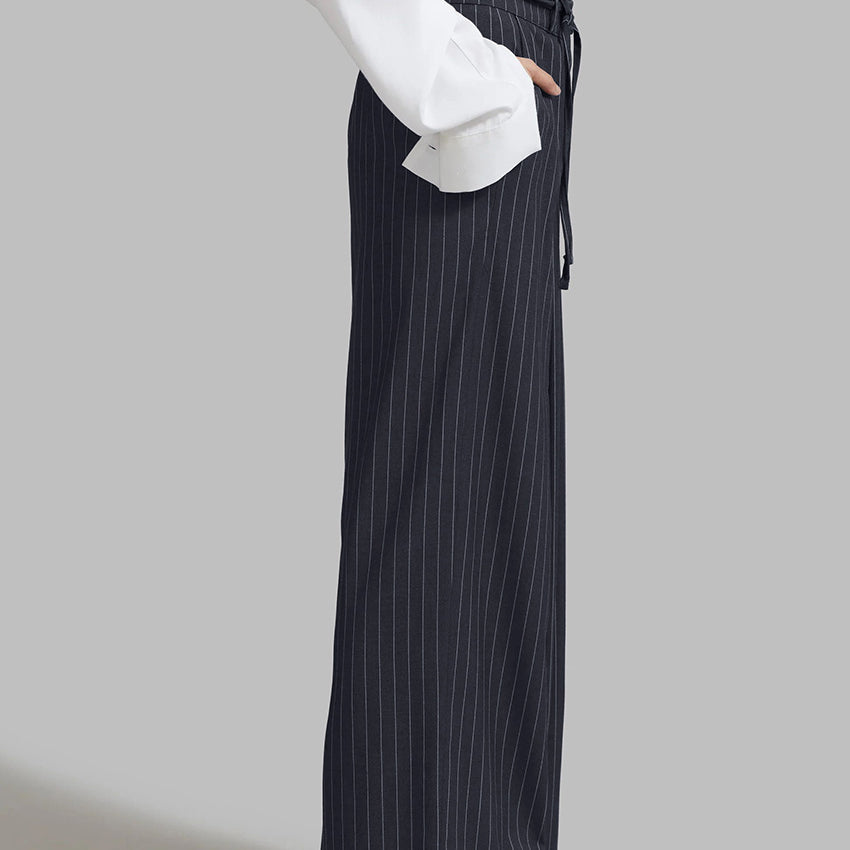 Women’s navy pinstripe loose drooping casual work pant with black tie belt