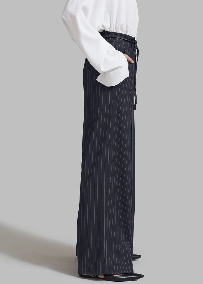 Women’s navy pinstripe loose drooping casual work pant with black tie belt