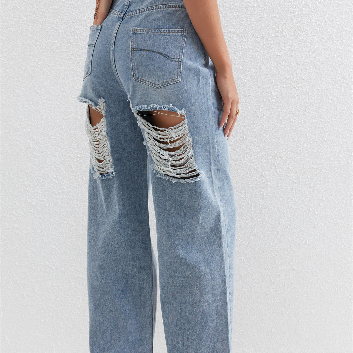 Light blue distressed wide-leg jeans with ripped holes perfect for casual fashion ملابس