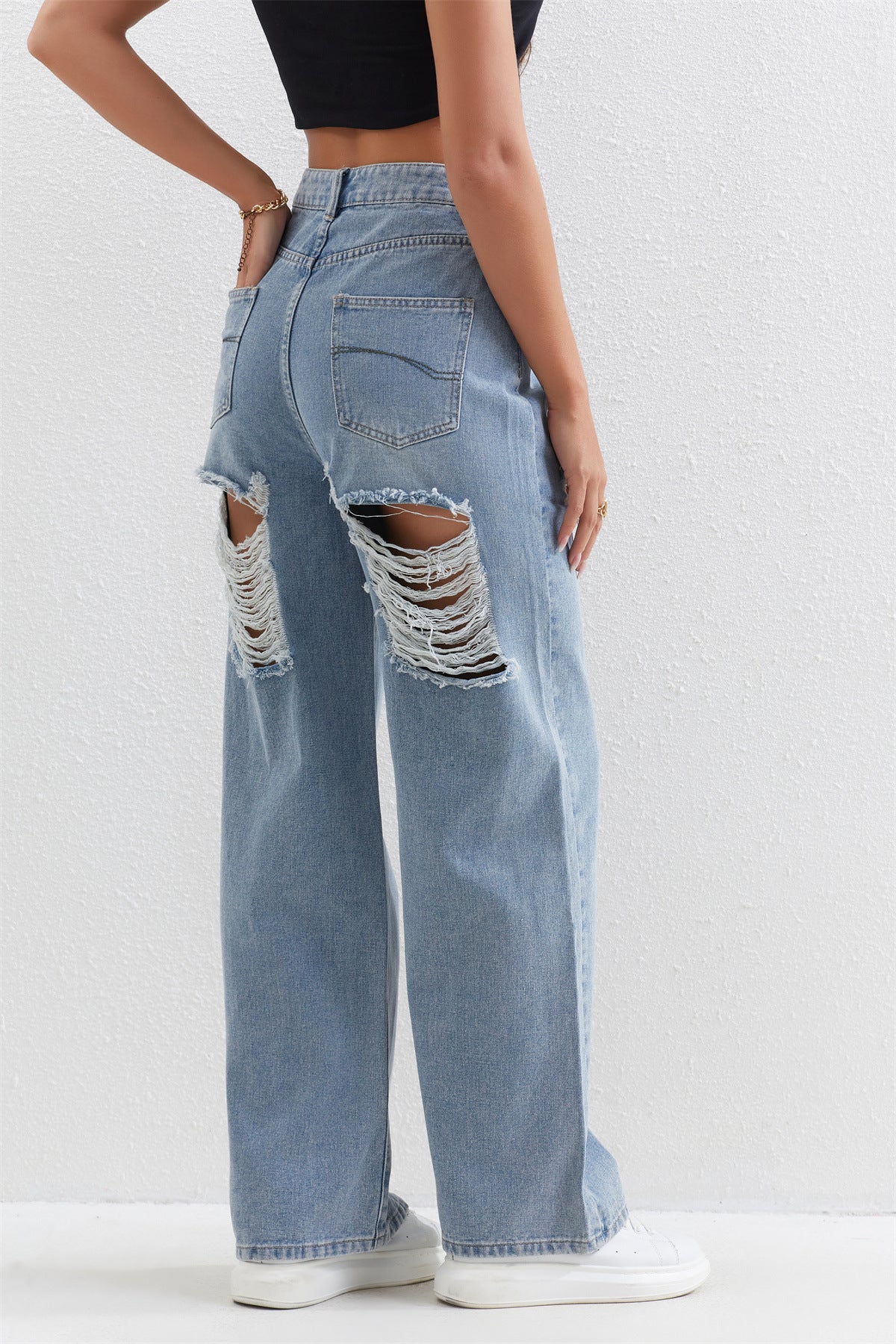 Light blue distressed wide-leg jeans with ripped holes perfect for casual fashion ملابس