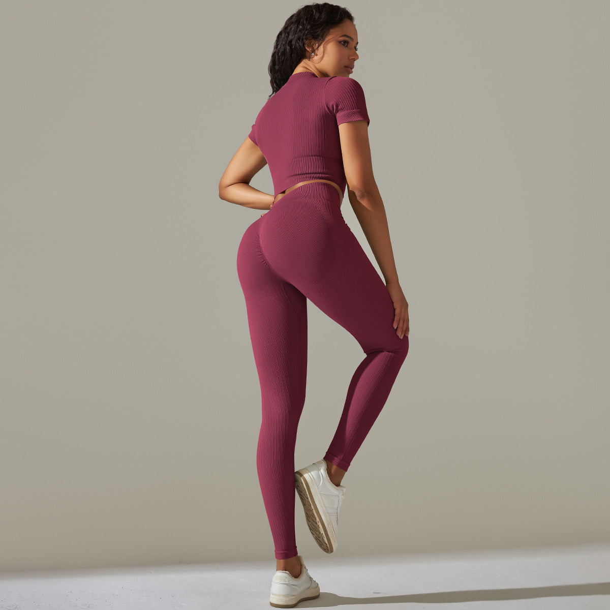 Seamless knitted peach burgundy ribbed athletic set with peach hip high waist design
