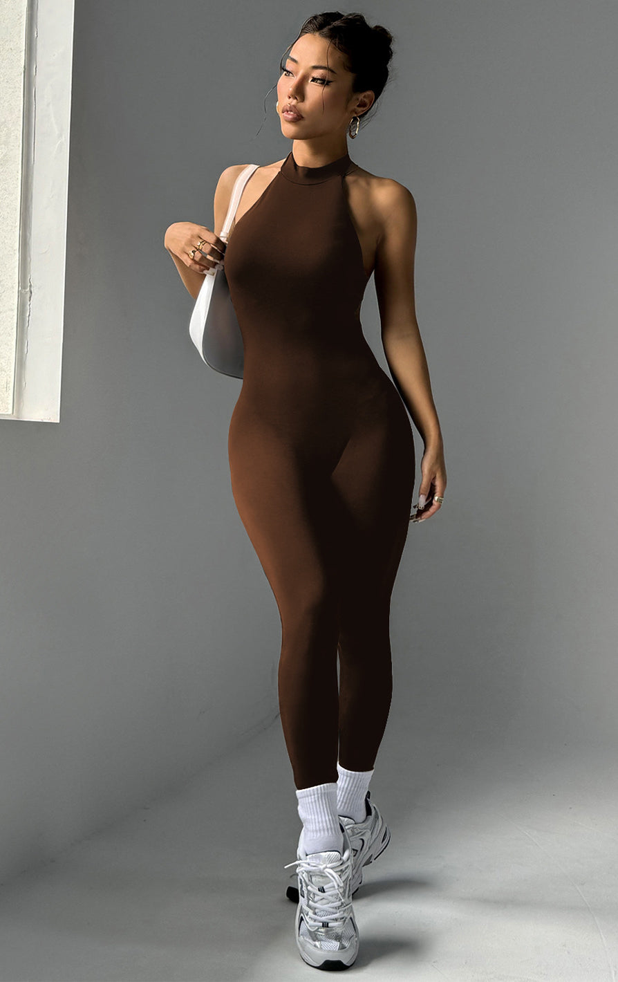 Sleek Langry brown high-neck yoga jumpsuit in form-fitting fashion ملابس