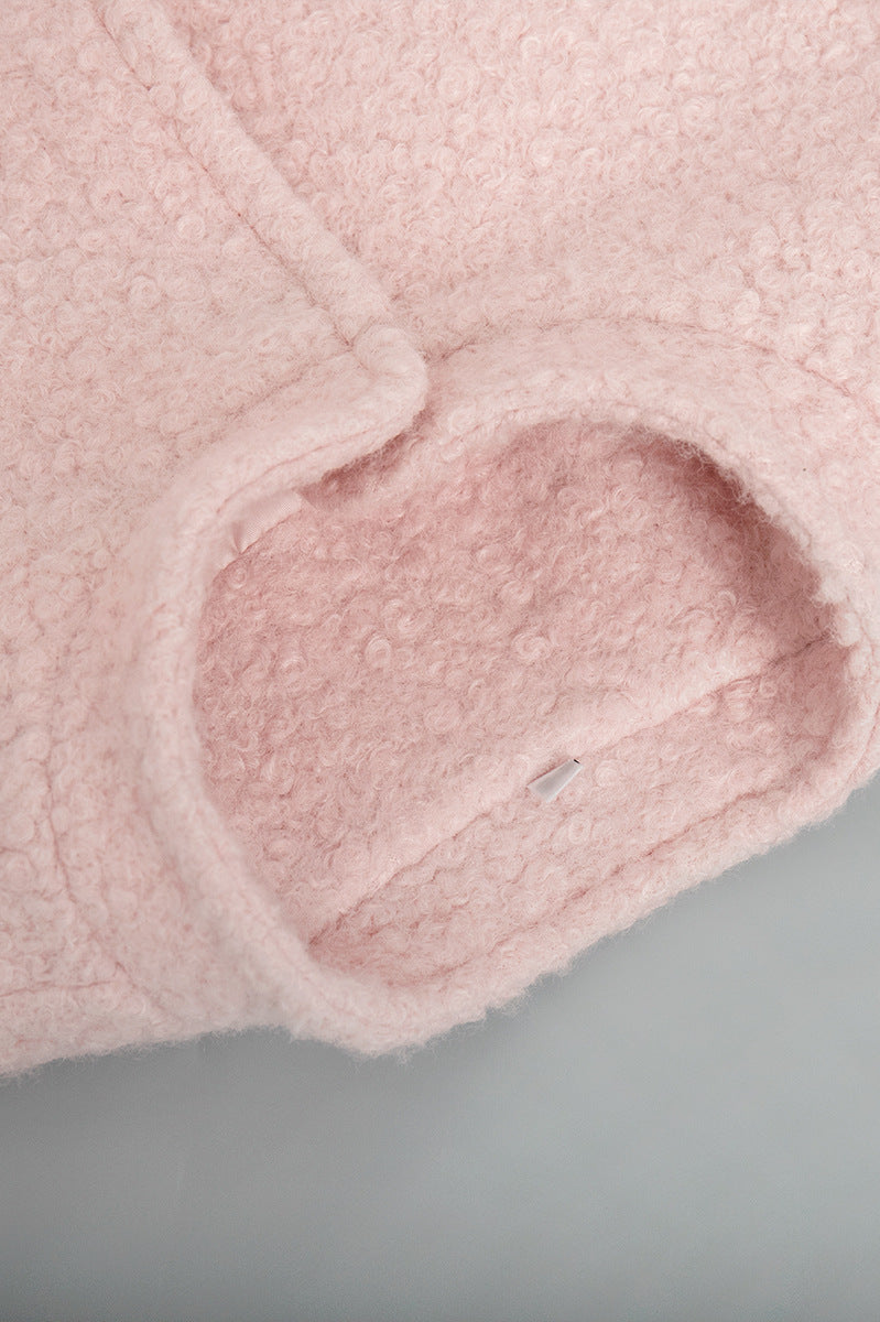 Close-up of pink fuzzy fabric sleeve on Pink Short Furry Coat for stylish cold-weather wear