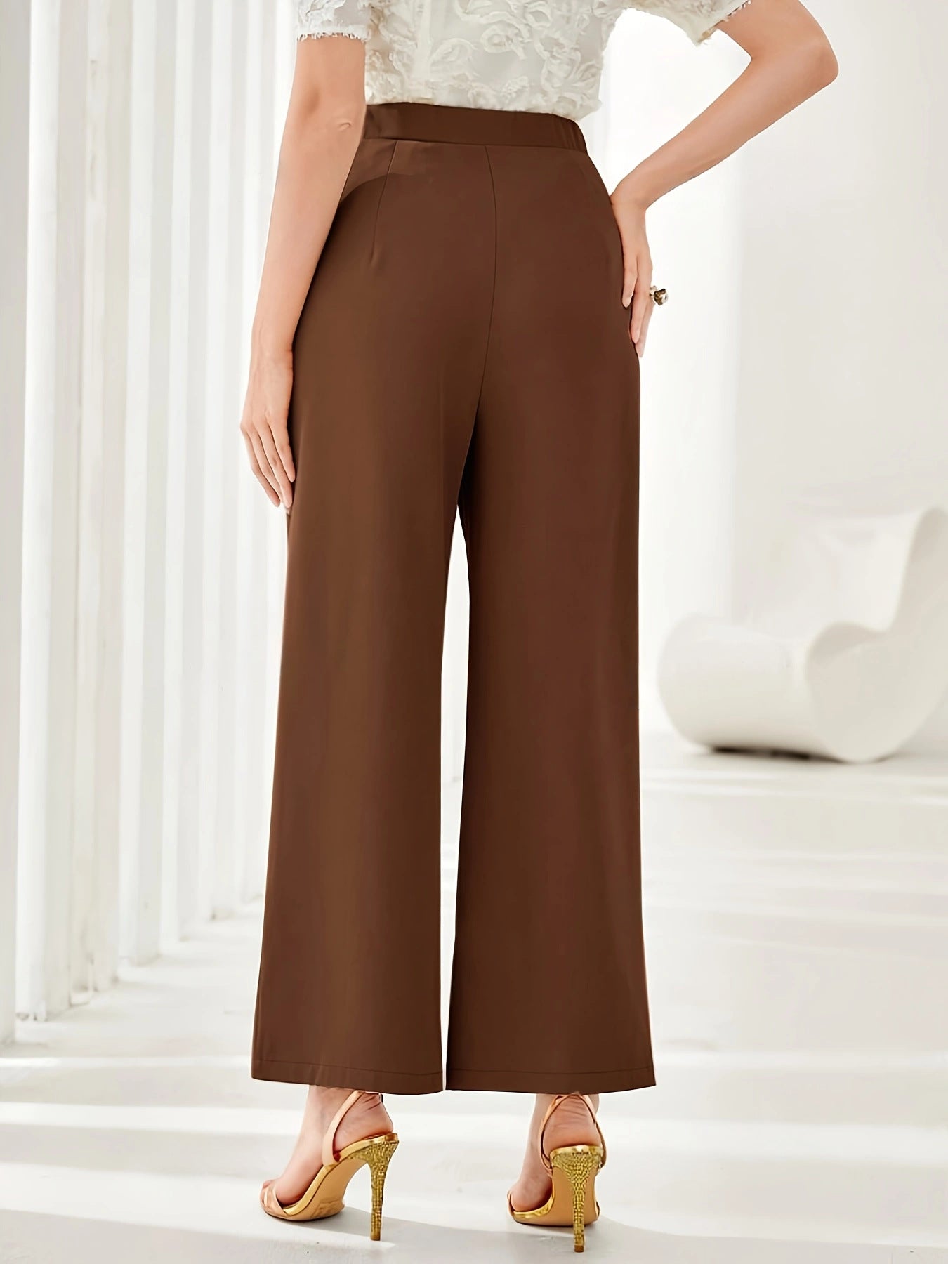 High-waisted brown wide leg palazzo pants in elegant casual fashion style