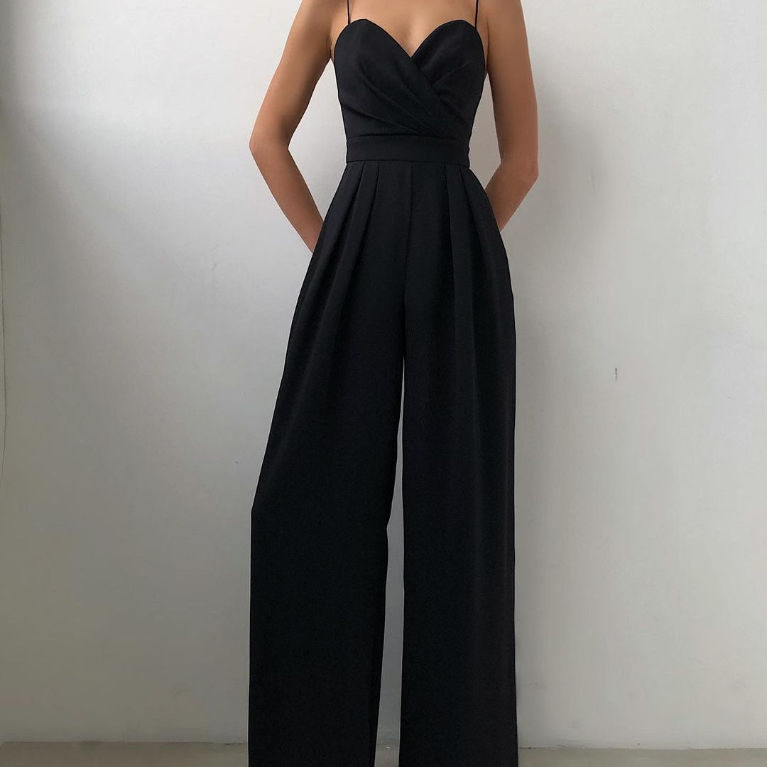 Elegant black wide-leg jumpsuit with spaghetti straps for modern fashion ملابس
