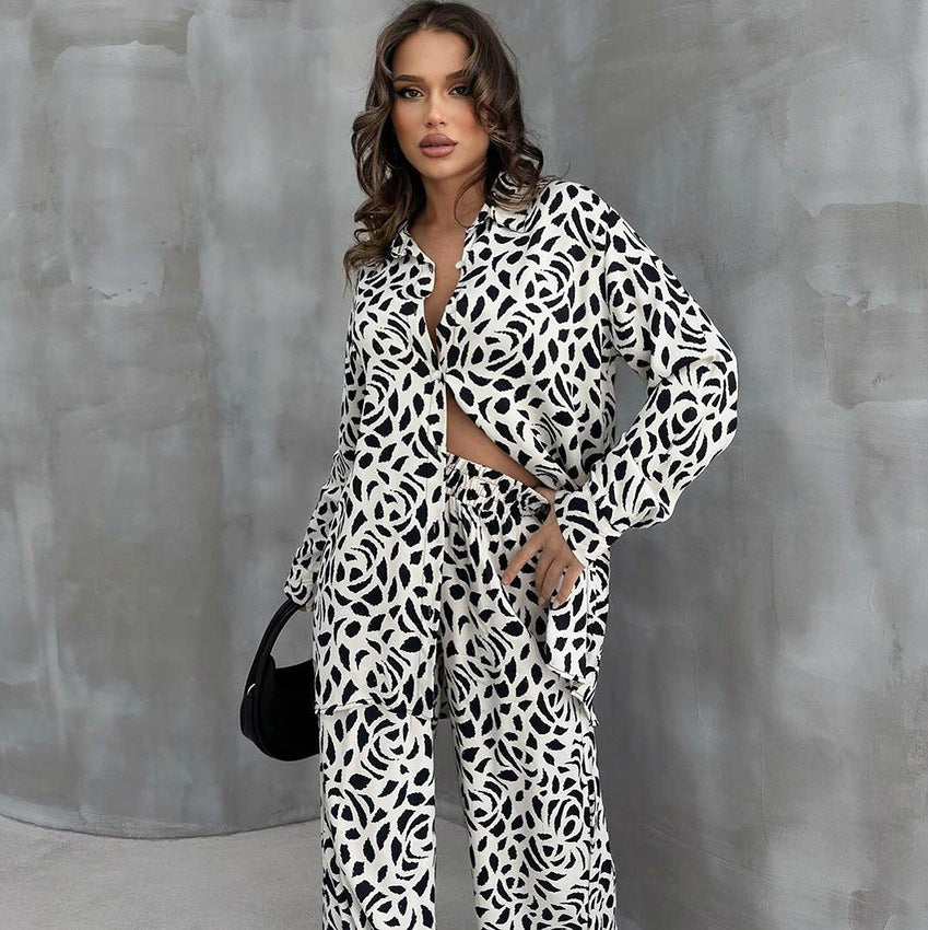 Woman wearing loose leopard print pajamas set with black and white pattern