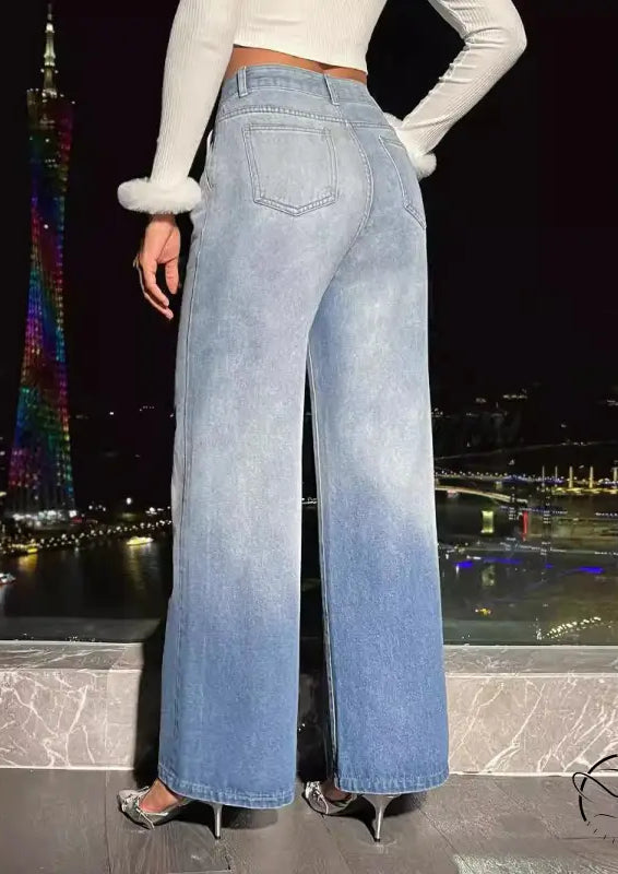 Women’s light blue ombre denim trousers with high heels