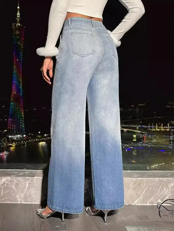 Women’s light blue ombre denim trousers with high heels