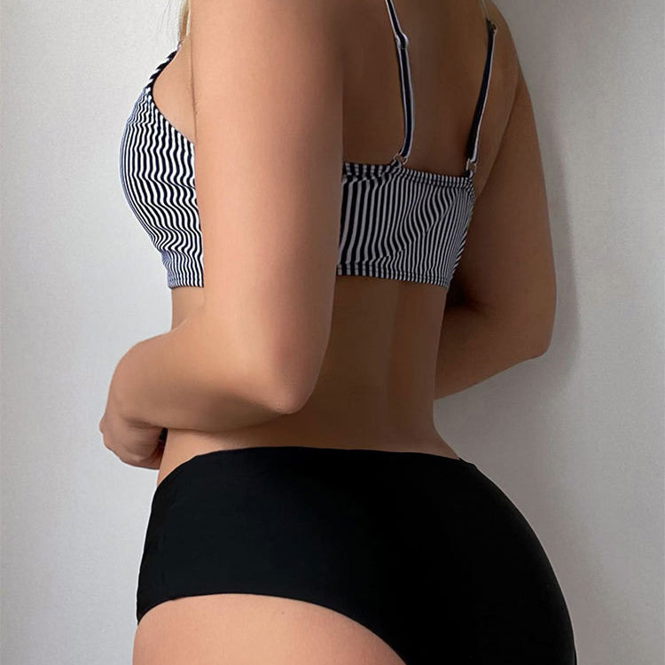 High waist triangle bikini top with striped pattern and black bottoms for stylish beachwear