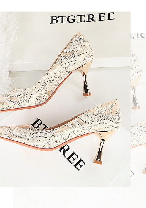 Langry fashion white snakeskin mid heel shoe with gold accents and tassel