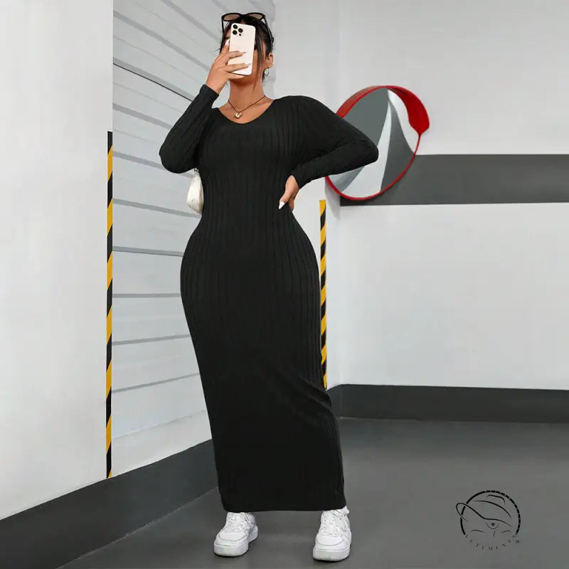 Black ribbed maxi dress in winter minimalist slim fit sheath style