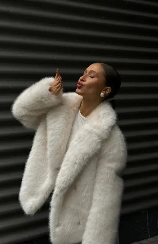 Winter warm faux fur coat with pearl earrings and round neckline