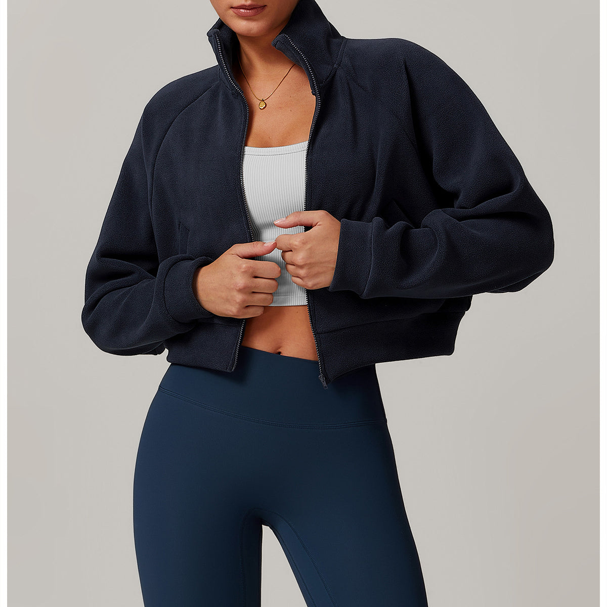 Navy blue cropped zip-up Running Windproof Velvet Fitness Coat with white crop top and blue leggings