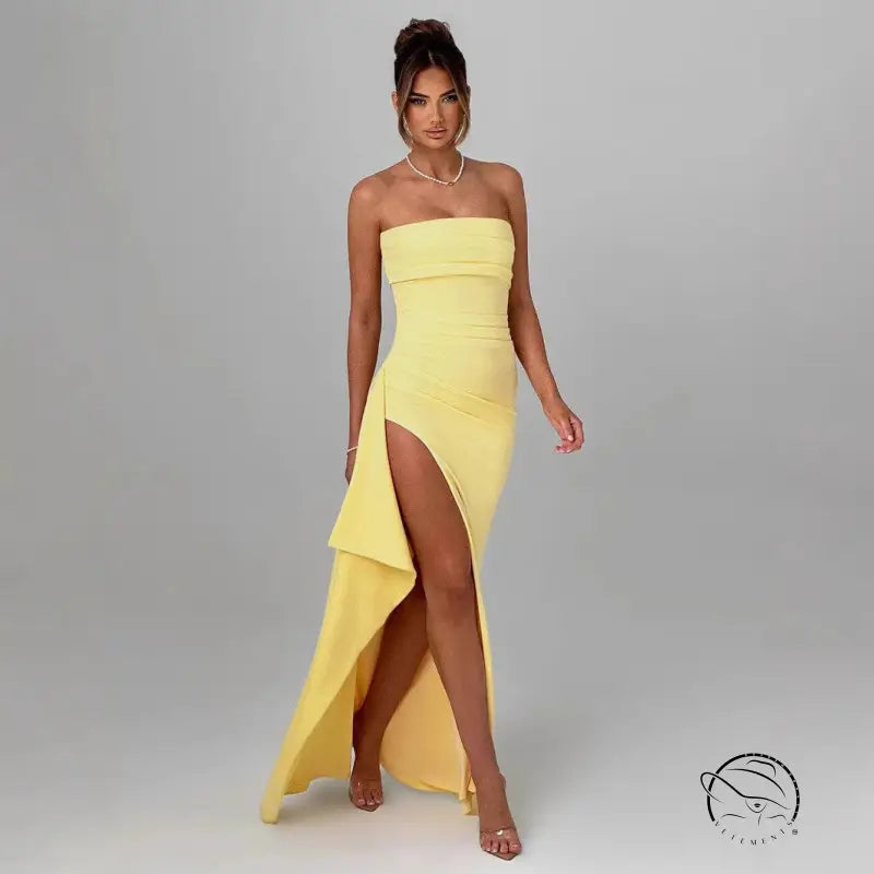 Beautiful langry fashion woman in yellow strapless side slit dress