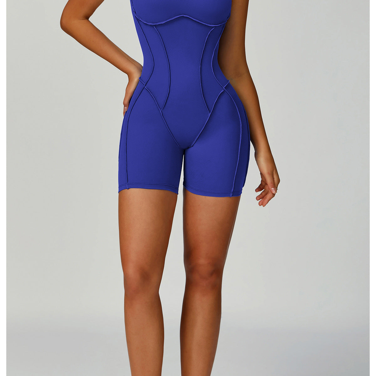 Royal blue langry fashion yoga jumpsuit in form-fitting bodysuit design with white sneakers