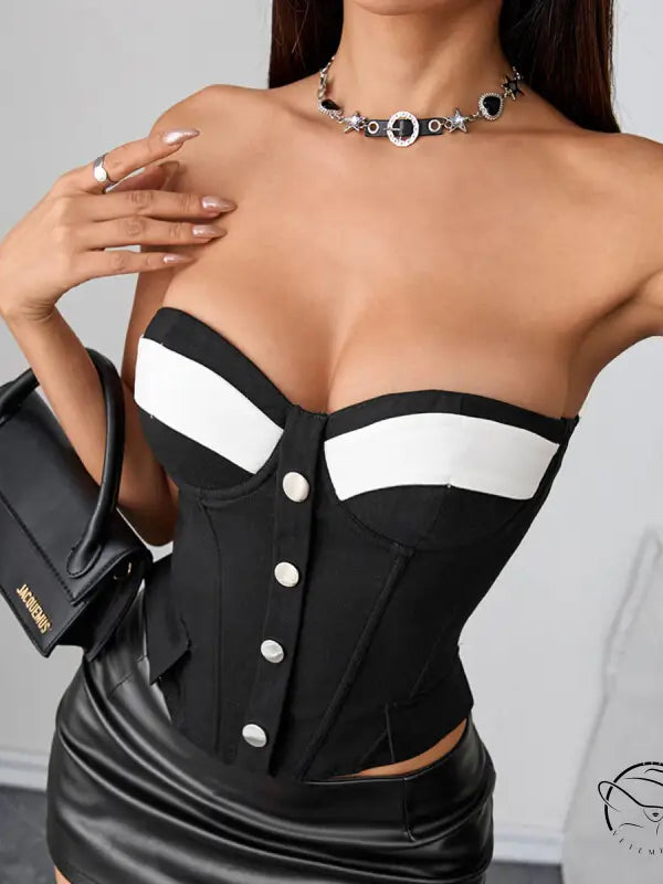 Black and white strapless corset with silver buttons and chest pad boning