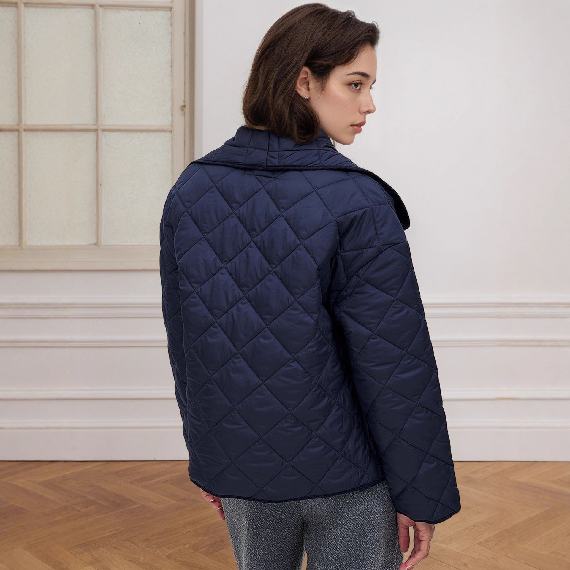 Navy blue quilted cotton padded coat with high collar and button closure