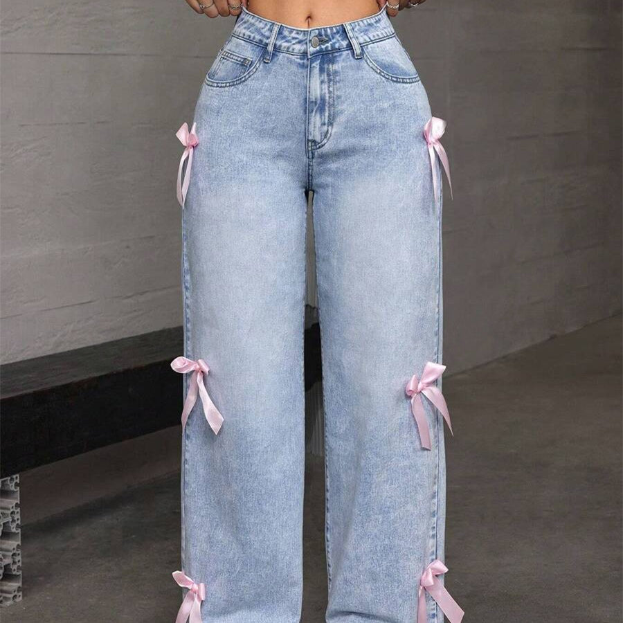 Light blue denim loose straight leg jeans with pink ribbon accents for a stylish look