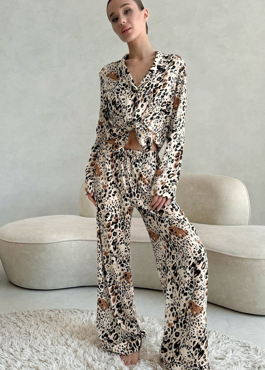 Woman in langry leopard print fashion pajamas set with cardigan
