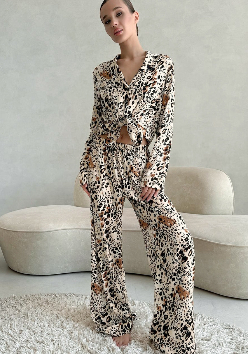 Woman in langry leopard print fashion pajamas set with cardigan