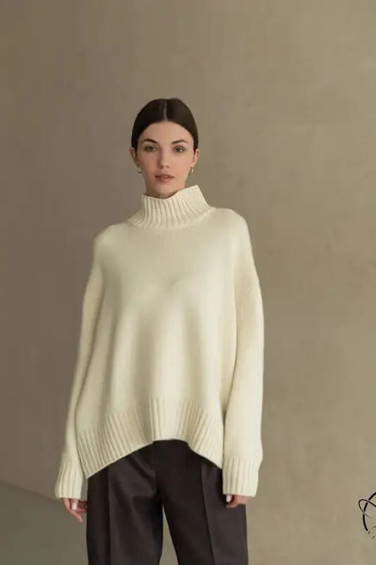 Cream oversized turtleneck langry fashion sweater with black pants