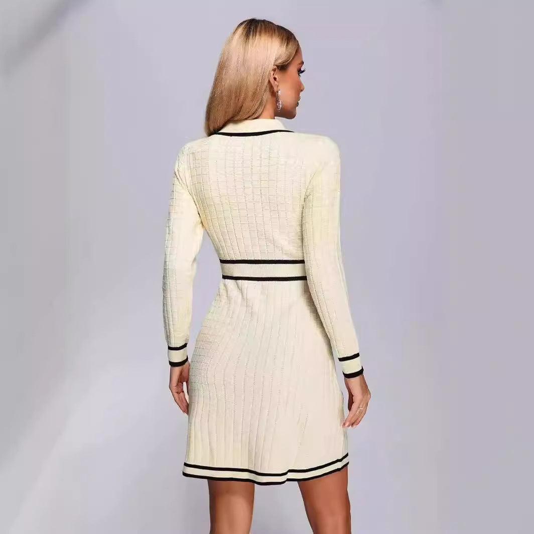 Cream-colored knitted classic dress with black trim, perfect for elegant occasions