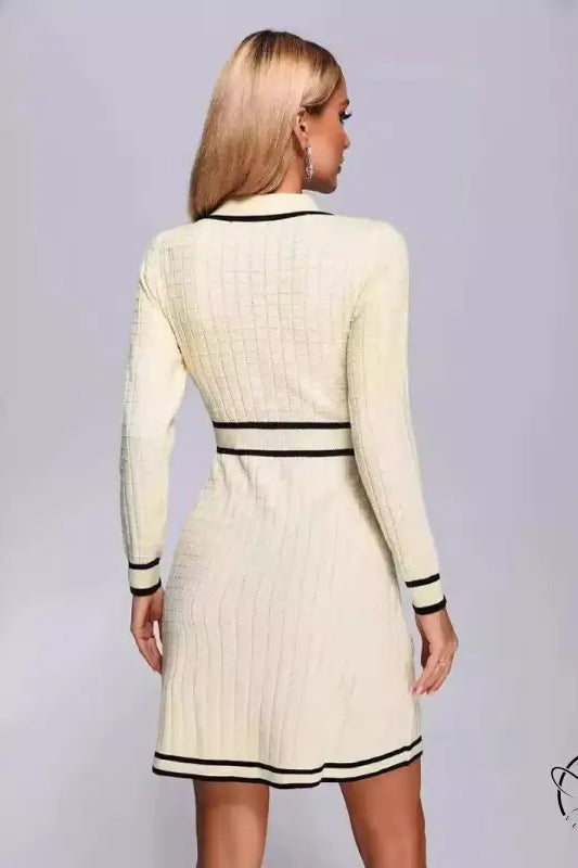 Cream-colored knitted classic dress with black trim