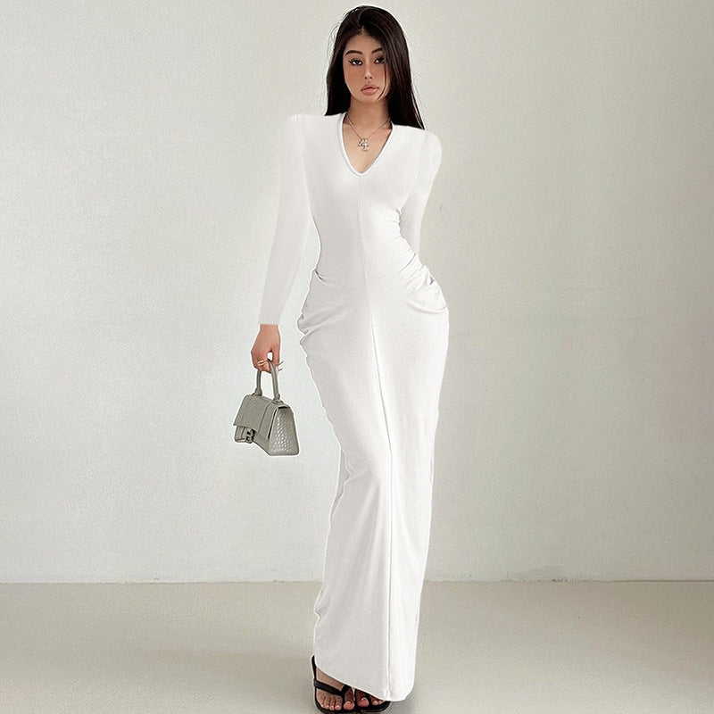 White long-sleeved v-neck jumpsuit with flared legs for stylish fashion ملابس