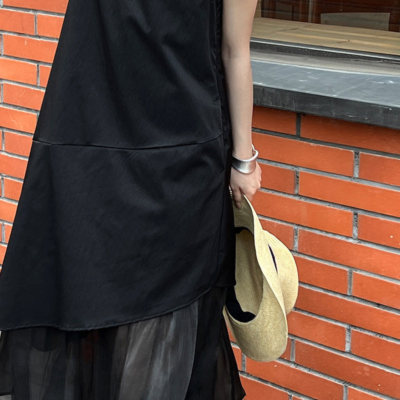 Elegant Korean style dress featuring a black layered sleeveless design with chiffon hem